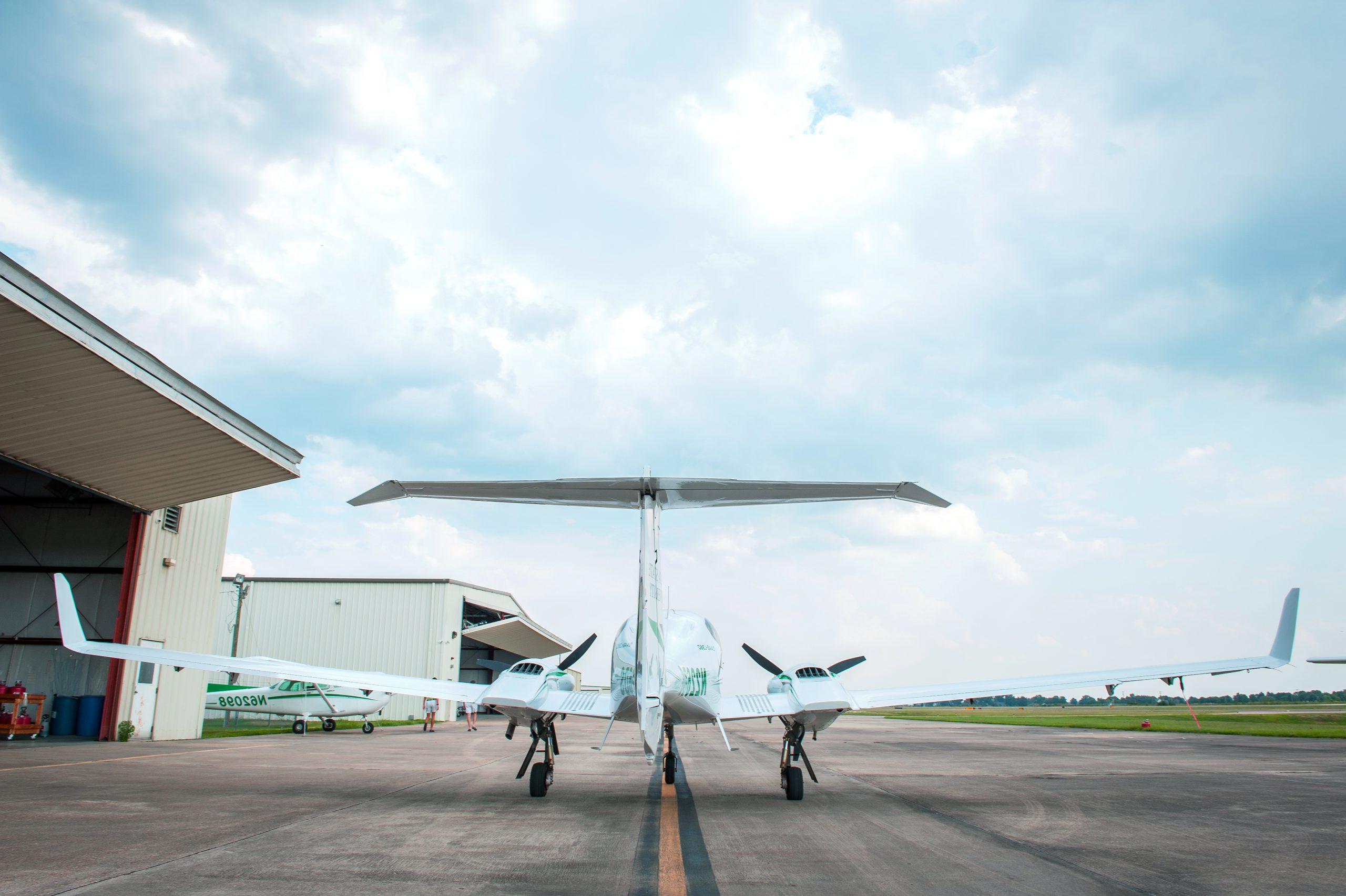 Delta State plan on runway near airport hanger.